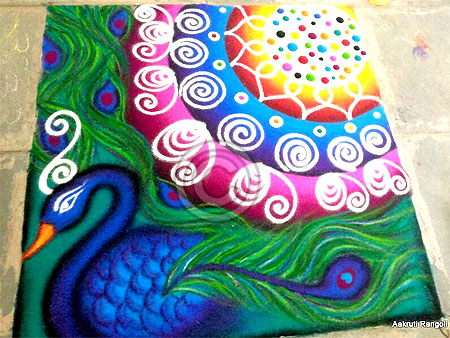 Colorful peacock freehand rangoli for holi festival 2015