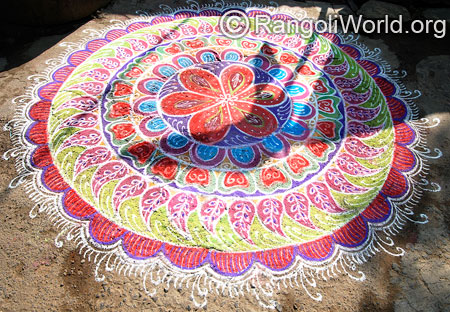 Big freehand festival rangoli with mango shapes mar