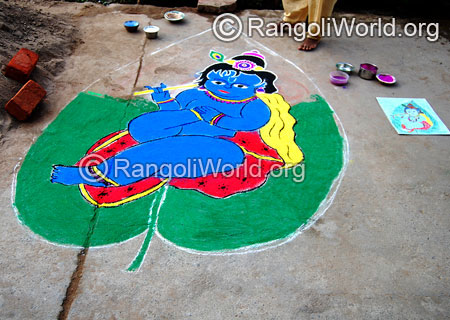Baby krishna with flute on leaf rangoli